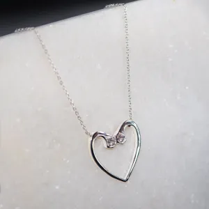 Charmed - Stylized Horseshoe Nail and Moissanite Stone Sterling Silver Heart Pendant Necklace
