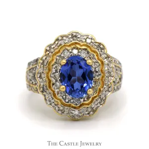 Oval Tanzanite Ring with 3/4cttw Diamond Accented Sides and Halo in 14k Yellow Gold